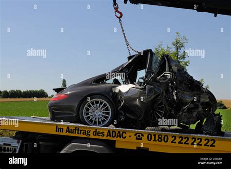Completely Smashed Wreck Of A Porsche Carrera S After A Serious Car