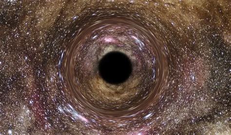 Ultramassive Black Hole Found Via Gravitational Lensing