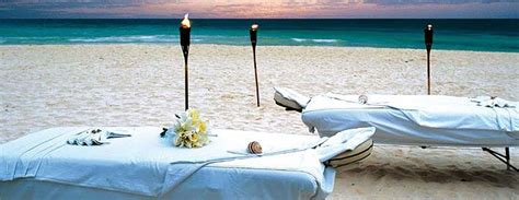 Couples Massage On The Beach At Sunset At Real Resorts Mexican Beach