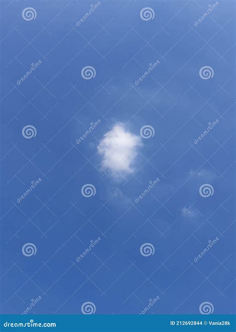 Blue Skies With Isolated Fluffy Cumulus Cloud Stock Photo Image Of