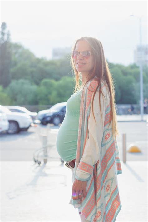 Pregnant Woman Is Walking On The Street Of The City Stock Image Image