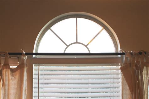 Venetian blinds can be tilted open and closed for light control and privacy. The ragged wren : Covering Arched Windows