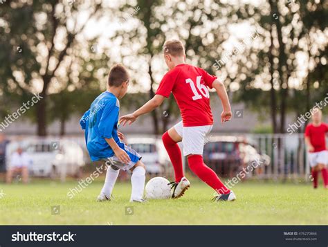 Photo De Stock Young Boys Playing Football Soccer Game 476270866