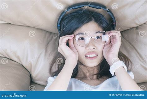 Nerdy Asian Girl With Glasses Is Listening To Music Stock Image Image Of Lifestyle Listen