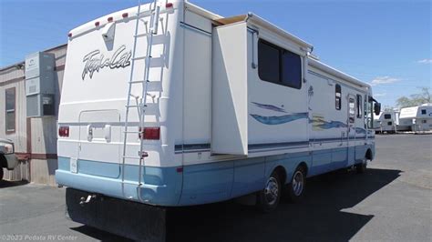 11040 Used 1999 National Rv Tropical 6373 W2slds Class A Rv For