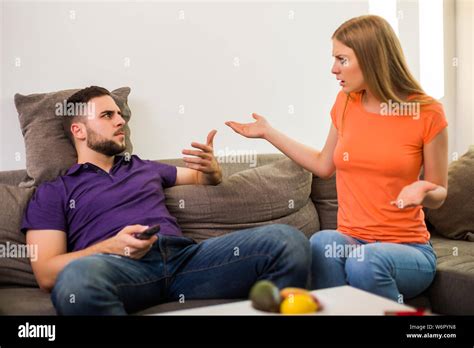Angry Wife And Husband Are Having Conflict Because Husband Is Watching