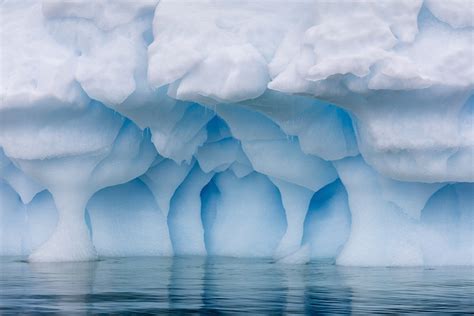 Transcendent Photos Of Antarcticas Cavernous Blue Ice Glaciers