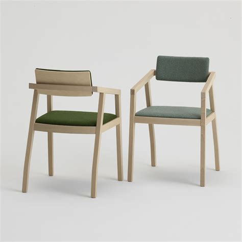 Most of us would have been obsessed with our ancestors' wooden armchairs. Aki 2.0 | Sandler Seating. Upholstered armchairs with a ...