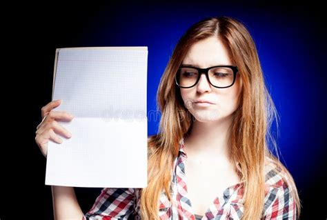 Disappointed And Sad Young Girl With Large Nerd Glasses Stock Photo