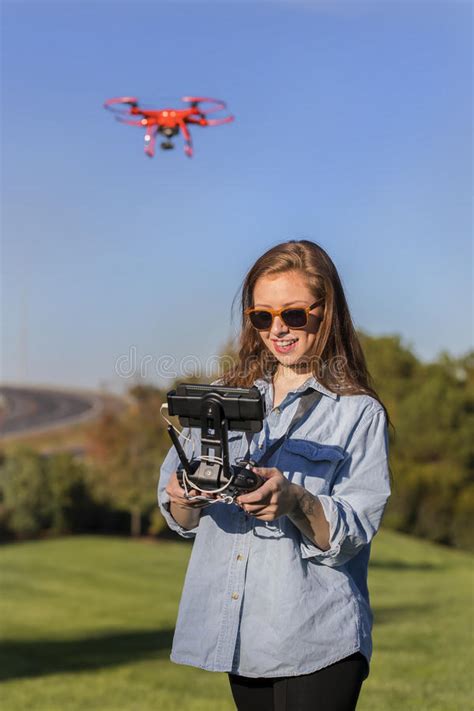 brunette coed flying a drone stock image image of hairstyle attractive 80054615