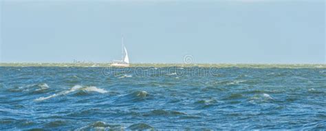 Sailing Boat Sailing In A Stormy Lake In Sunlight Stock Image Image
