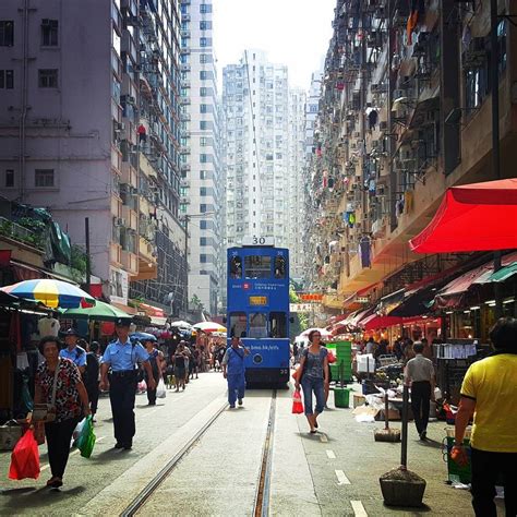 375 king's road in eastern, 3 miles from the center of hong kong. Tram driving in wet market at North Point, Hong Kong ...