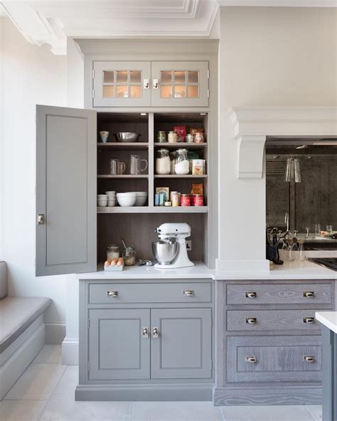 This is the space to store small appliances you use daily, as well as papers: Humphrey Munson on Instagram: "Countertop cupboard with glazed top boxes above for additional ...