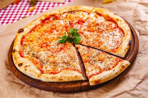 Italian Pizza Margherita With Tomatoes And Mozzarella Cheese On Wooden