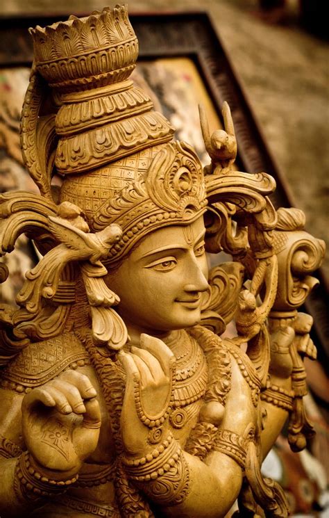 A Delicately Carved Wooden Idol Of A Hindu God Captured At The Famous