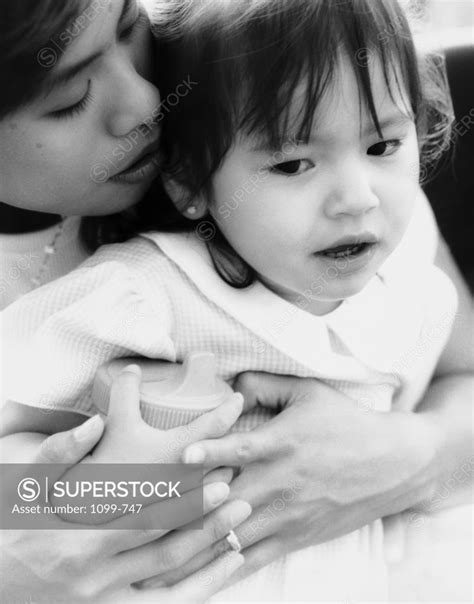 Close Up Of A Mother Hugging Her Daughter Superstock