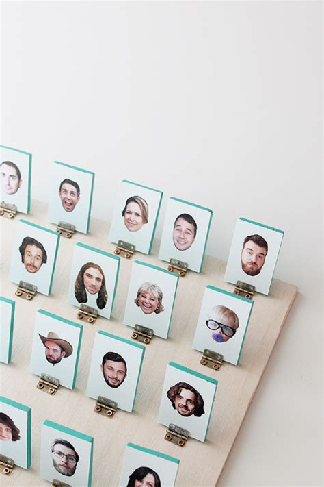 A Wooden Table Topped With Lots Of Small Magnets Covered In Photos And