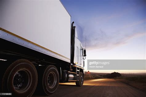 Semitruck Driving On Dirt Road High Res Stock Photo Getty Images