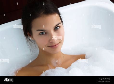 Woman Relaxing In Bubble Bath Portrait Stock Photo Alamy