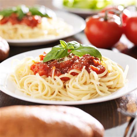 Plate Of Spaghetti With Basil Garnish Stock Photo Image Of Garnish