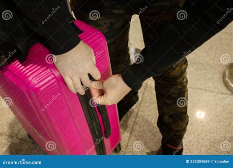 The Passenger Closes The Suitcase With A Combination Lock At The Airport Luggage Theft Lost