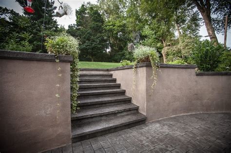 Retaining walls are mainly used to keep the slope of elevated soil or other elevated material to prevent soil you can build retaining walls in a variety of materials in many different ways. Backyard Stamped Concrete and Wall Spray into Retreat