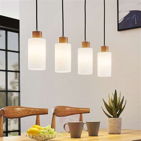 Japanese hanging lamps everywhere will bring a touch of asian charm and wrap the interior with warm light. Lindby Nicus wooden hanging lamp, four-bulb | Lights.co.uk