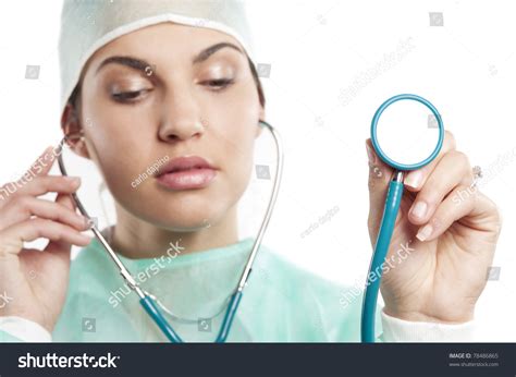 Pretty Nurse Wearing A Surgery Dress With Cap With A Stethoscope