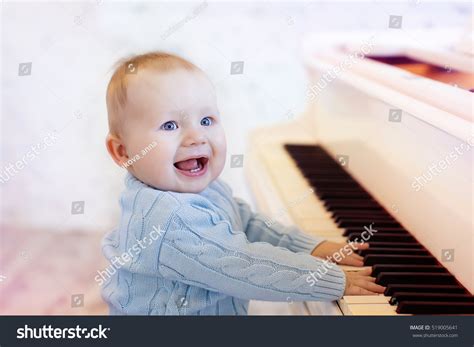 Cute Laughing Baby Playing The Piano Stock Photo 519005641 Shutterstock