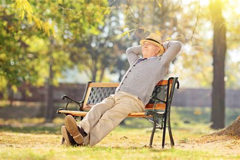 Senior Man Relaxing In Park On A Sunny Day Stock Image Image Of Fall