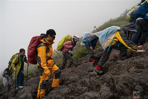 Making The Climb To The Summit Of Majestic Mount Fuji — Ap Images Spotlight