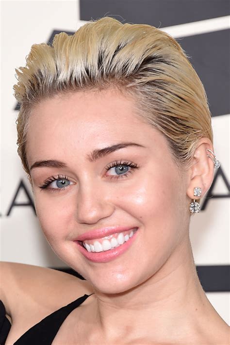 Miley Cyrus Straight Ash Blonde Dark Roots Slicked Back Hairstyle