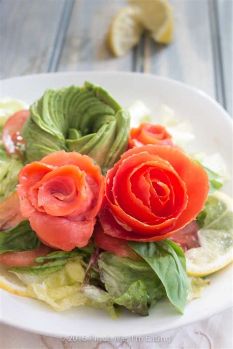 Smoked salmon salad is a colourful dish combining the crunch of black olives with the zest of fresh lemon juice. Smoked salmon, tomato, and avocado rose salad | Pinch me, I'm eating!