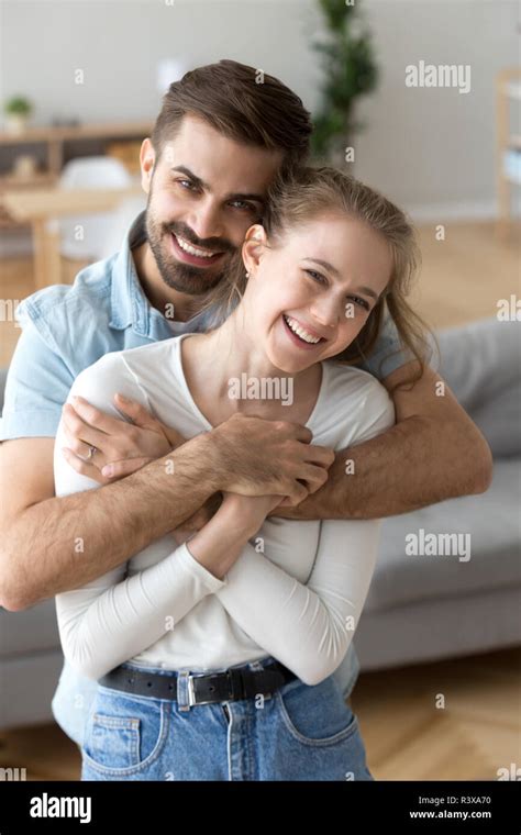 Portrait Of Smiling Husband Hold In Arms Young Happy Wife Stock Photo