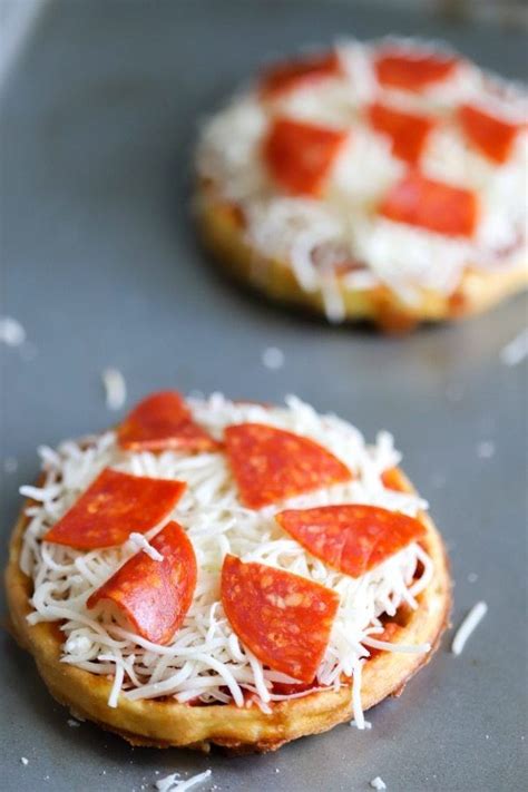 We make these all the time! two pizza chaffle on a baking sheet ready to go into the ...