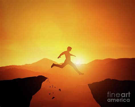 Man Jumping From One Rock To Another Sunset Mountains Scenery