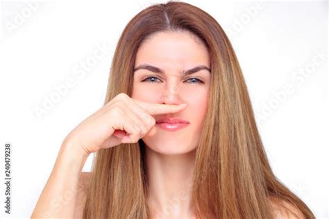 Gorgeous Woman Crits Her Face With Her Index Finger Under Her Nose