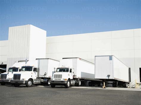 Trucks And Warehouse Stock Photo