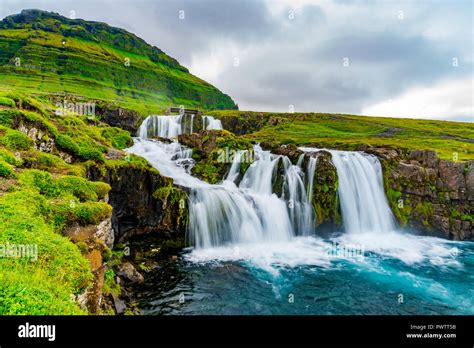 View Of Kirkjufellsfoss Waterfalls At Kirkjufell Mountain In The Summer