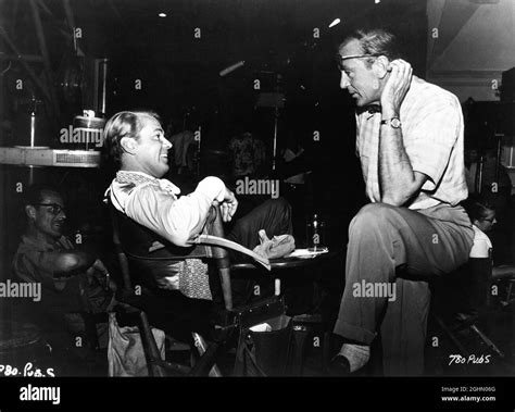 alan ladd with set visitor gary cooper on set candid during filming of the iron mistress 1952