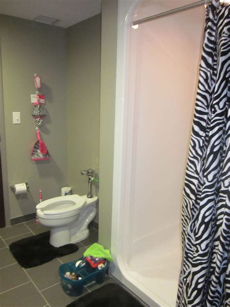 For example, in a bathroom relatively flat with white tiles and white walls, hang a zebra print shower curtain in black and white, then add towels, bath mats and accessories counter in one bright color, as. the zebra bathroom | Zebra bathroom, Basic shower curtain ...