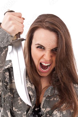 Shot Of A Beautiful Girl Holding Knife Stock Photo And Royalty Free