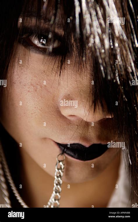 Portrait Of Funky Japanese Teen With Facial Piercing In Harajuku Japan