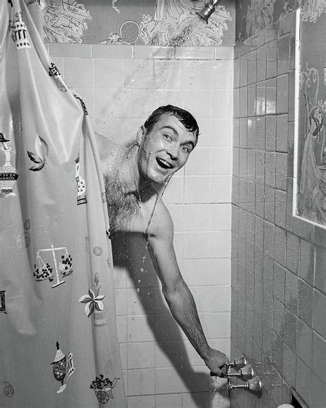 S Man In Shower Turning On Water Photograph By Vintage Images