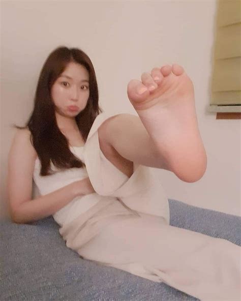 What Is The Name Of This Korean Idol Who Is Posing With Cute Feet