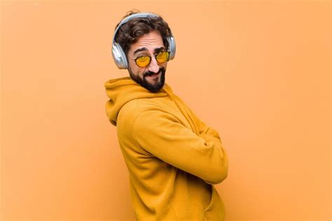 Premium Photo Young Crazy Cool Man Listening Music With Headphones