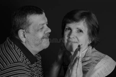 Portrait Of Caucasian Senior Man And Woman In Low Key Stock Image