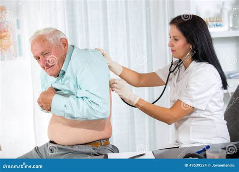 Doctor Examining A Senior Patient Stock Photo Image Of Injection Appointment