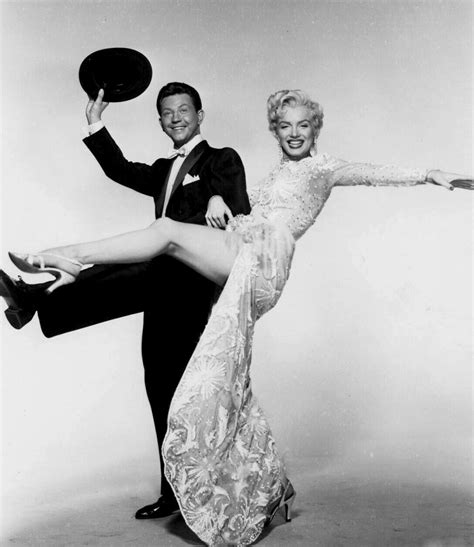 marilyn monroe and donald o connor in a publicity photograph for there s no business like show