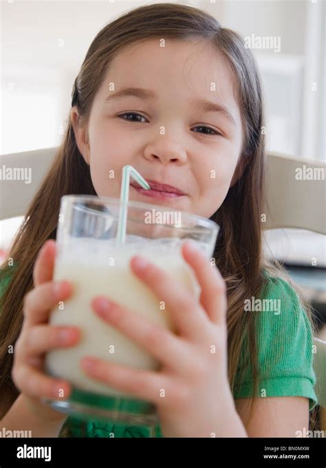 Mixed Race Girl Drinking Milk Stock Photo Alamy